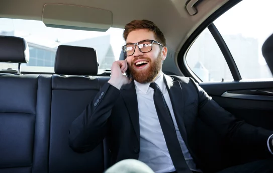 woman-using-mobile-while-car 1-2